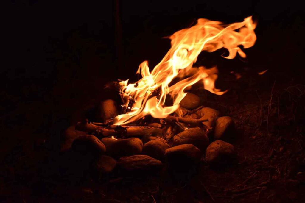 A fire in the woods at night