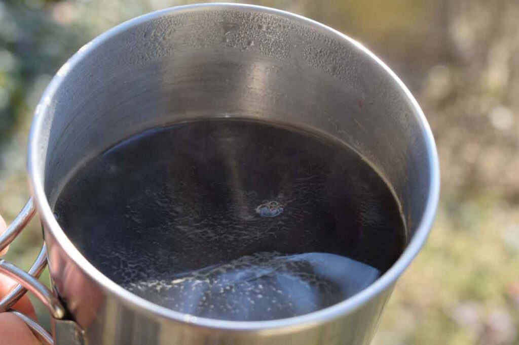Campfire Coffee in a stainless steel camping cup