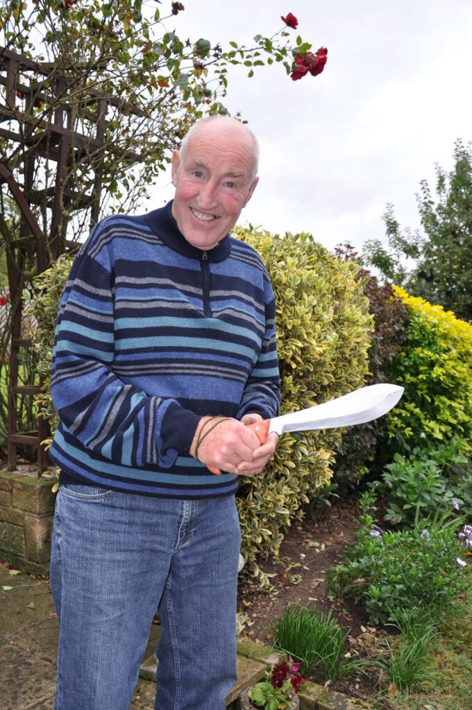 John (Lofty Wiseman holding the ultimate survival knife