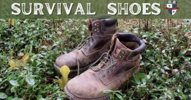 An Image Of a Pair Of Brown Leather Survival Shoes on The Ground Surrounded By Green Leaves With The Words Survival Shoes Written On Top Of The Image In White.
